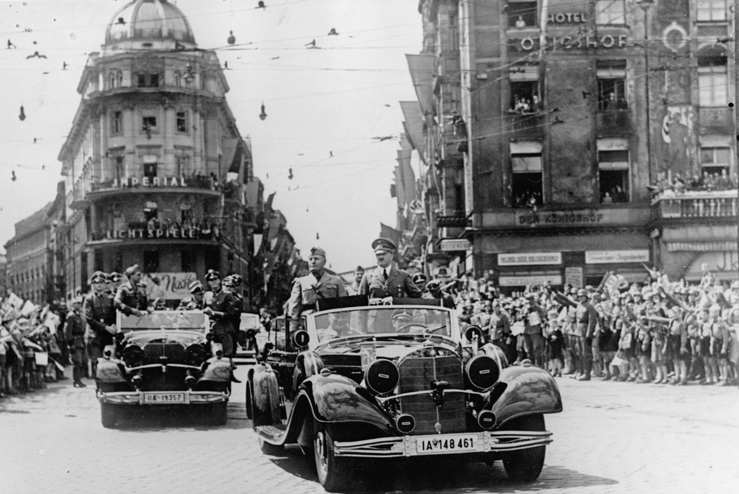 Adolf Hitler and Benito Mussolini on a car parade through Munich